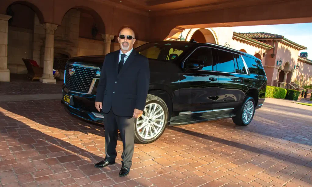 joe with black car awaiting pickup at the grand del mar